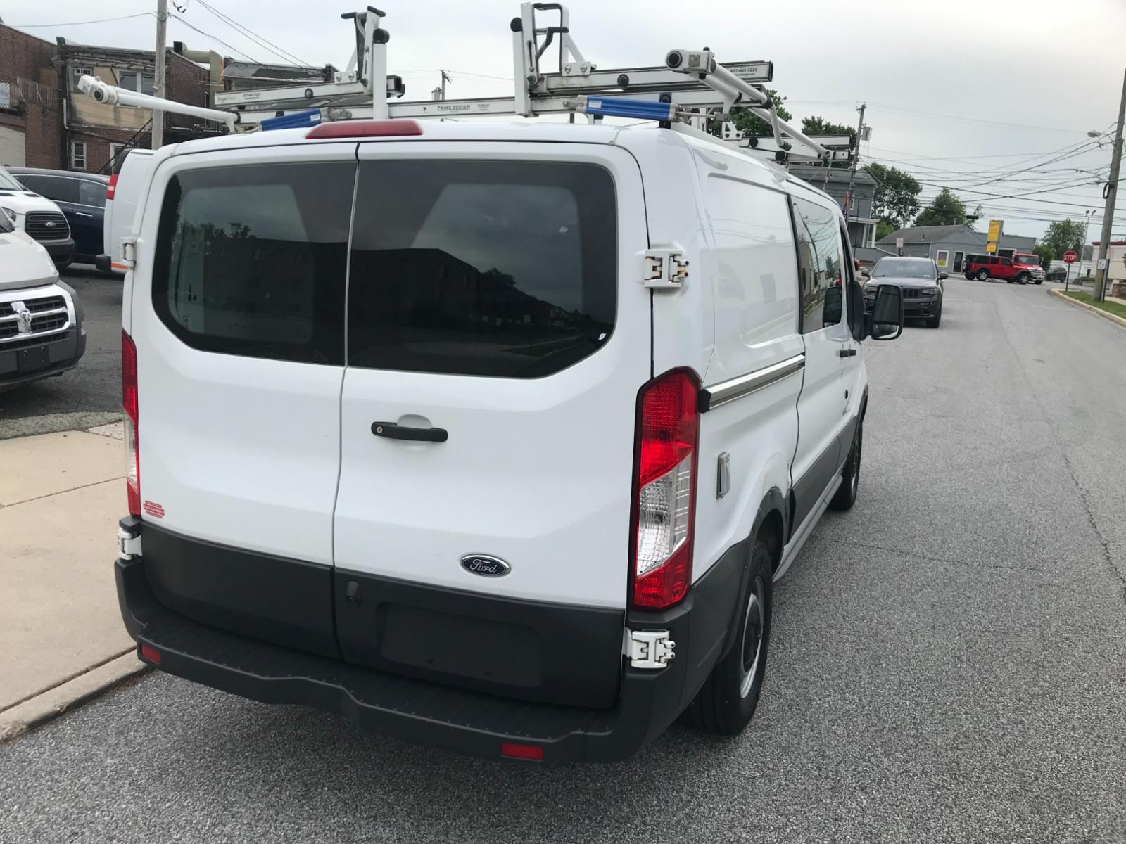 2018 White /Gray Ford Transit 150 (1FTYE1YM1JK) with an 3.7 V6 engine, Automatic transmission, located at 577 Chester Pike, Prospect Park, PA, 19076, (610) 237-1015, 39.886154, -75.302338 - 2018 Ford Transit 150: Dual drop down ladder racks, multiple pieces of shelving, power inverter w/ outlet, heavy duty partition, FLEET MAINTAINED, runs LIKE NEW! This vehicle comes inspected and has been given a bumper to bumper safety check. It is very clean, reliable, and well maintained. We of - Photo #6